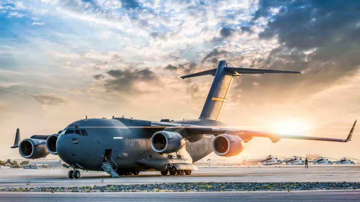 Large military transport aircraft at sunset